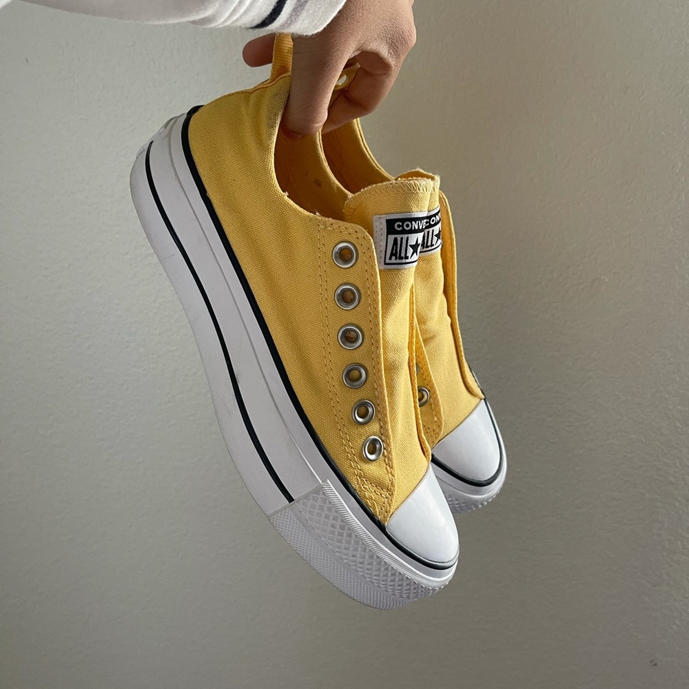 Yellow converse platform.